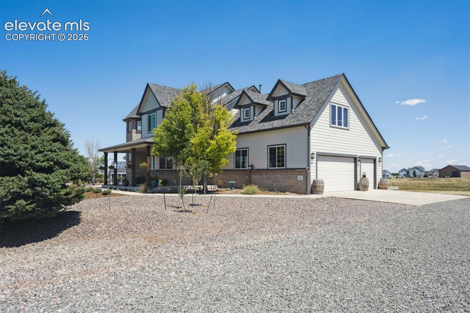 Welcome home to this striking two-story residence combining classic Craftsman charm with modern luxury. Featuring a beautiful blend of neutral horizontal siding, brick accents, and multiple dormer gables, the exterior delivers exceptional curb appeal.