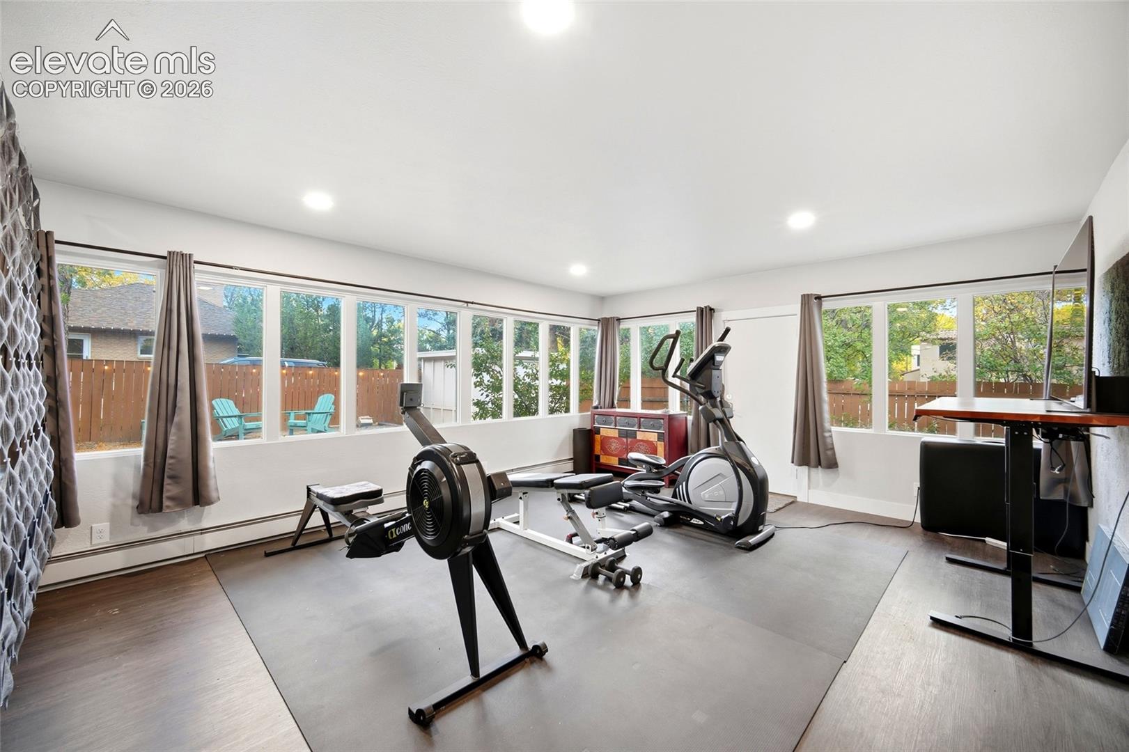 The entire back of the home is lined with windows overlooking the pool and back-yard. The sun-room is currently divided into different activity areas but you can use the space however you wish. 