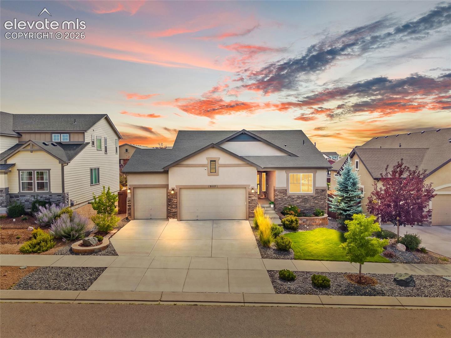 Welcome home to this hidden gem in the highly desirable North Fork at Briargate community! Located in award-winning Academy School District 20, within walking distance of Pine Creek High School and Encompass Heights Elementary School, this stunning ranch-style home shows better than new, with pride of ownership shining throughout!From the moment you arrive, the beautifully manicured landscaping and inviting curb appeal set the tone. Inside, enjoy abundant natural light, meticulously maintained hardwood floors, tasteful upgrades, and a thoughtfully designed open-concept floor plan.The gorgeous kitchen features quartz countertops, stainless steel appliances, a gas range, spacious walk-in pantry, and beautiful finishes. Open to the dining and living areas, it’s ideal for everyday living and entertaining. A stone-accented fireplace adds warmth and character, while elegant metal railings provide a modern touch.The ranch-style layout offers two main-level bedrooms, including a beautiful primary retreat with a stylish accent wall and charming barn door. Even the laundry room has personality and style! The finished basement provides two additional bedrooms and plenty of room to spread out.The three-car garage offers ample space for vehicles, tools, toys, and winter workout equipment.And just wait until you see the backyard! Enjoy lush green space, an inviting patio for summer barbecues, and breathtaking Pikes Peak views. Whether sipping morning coffee or hosting friends and family, this outdoor retreat is sure to become a favorite gathering place.Conveniently located near the United States Air Force Academy, I-25, shopping, dining, parks, and countless amenities, this home offers the best of Colorado Springs living.Immaculately maintained, tastefully upgraded, and completely move-in ready, this North Fork beauty simply feels right. Schedule your private showing today