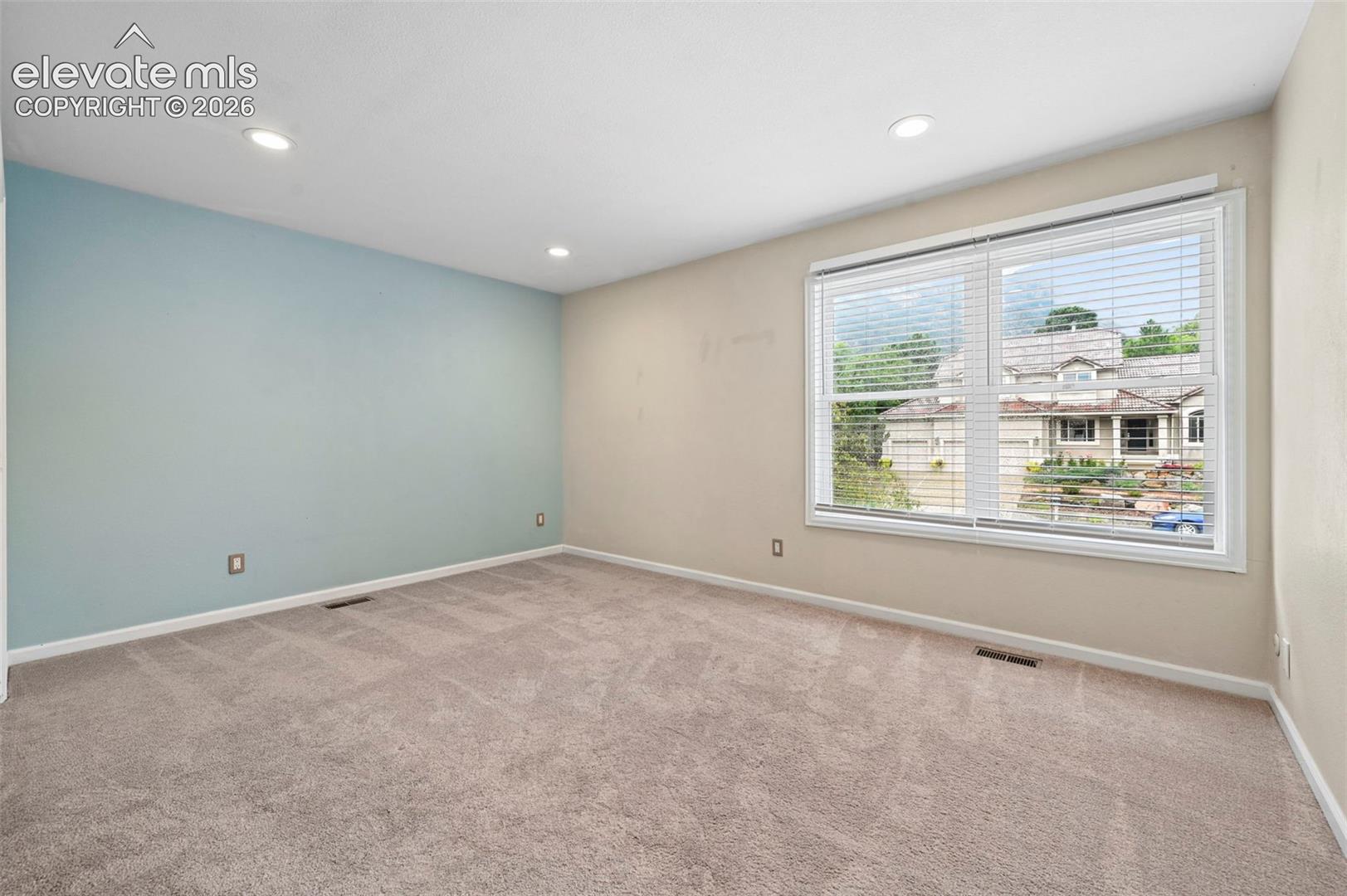 Unstaged bedroom with incredible views of Cheyanne mountain