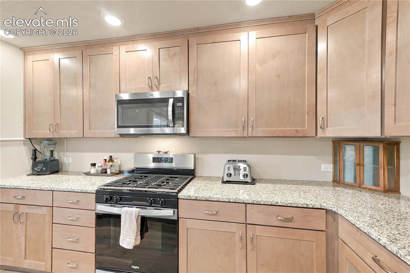 Soft pull cool Dusk stain cabinets with upgraded hardware.