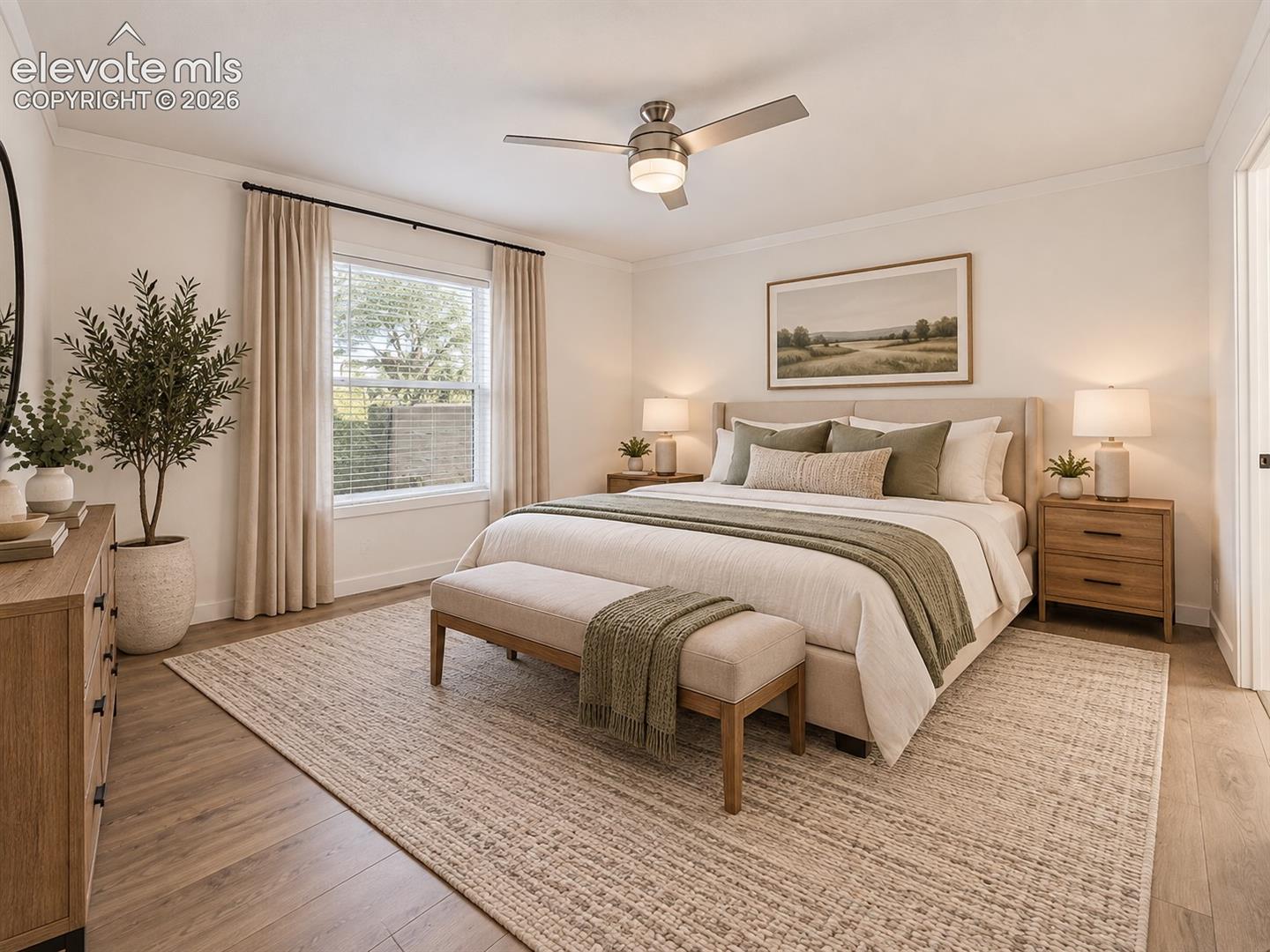 Primary Bedroom – Another view of the primary bedroom highlights its generous proportions, natural light, and clean, neutral finishes.