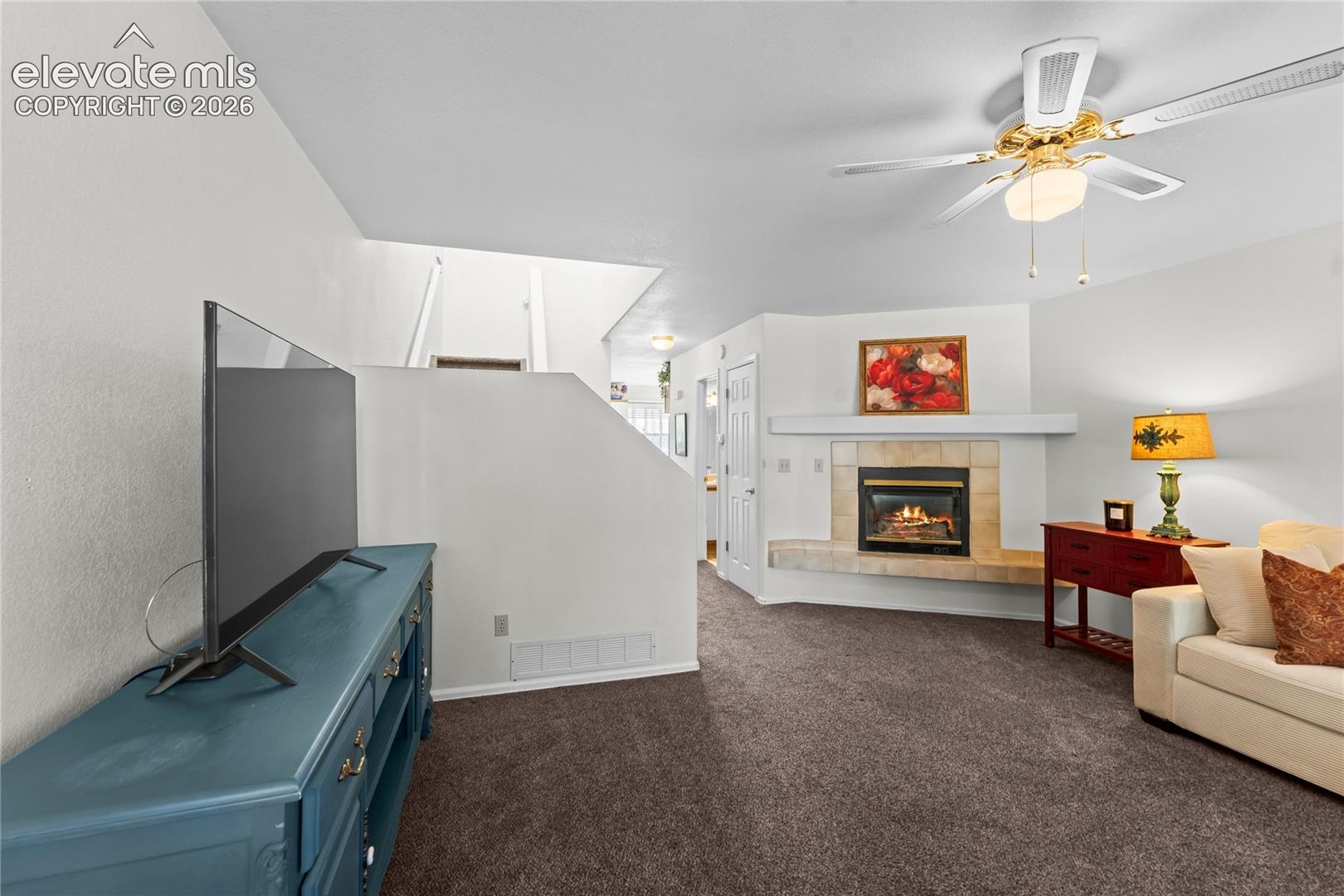Built-in fireplace with tile surround and mantel