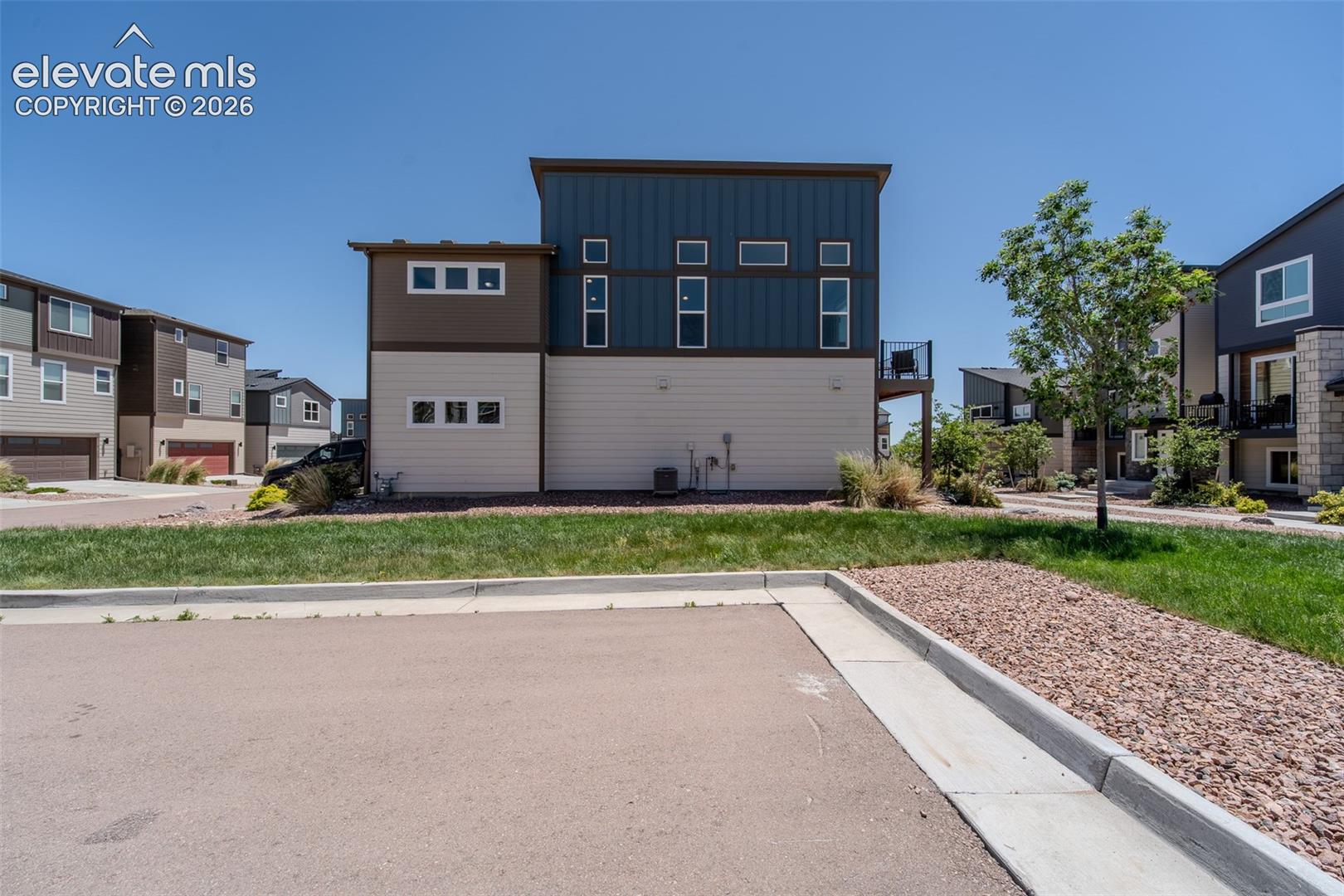 Guest parking and side yard of home.