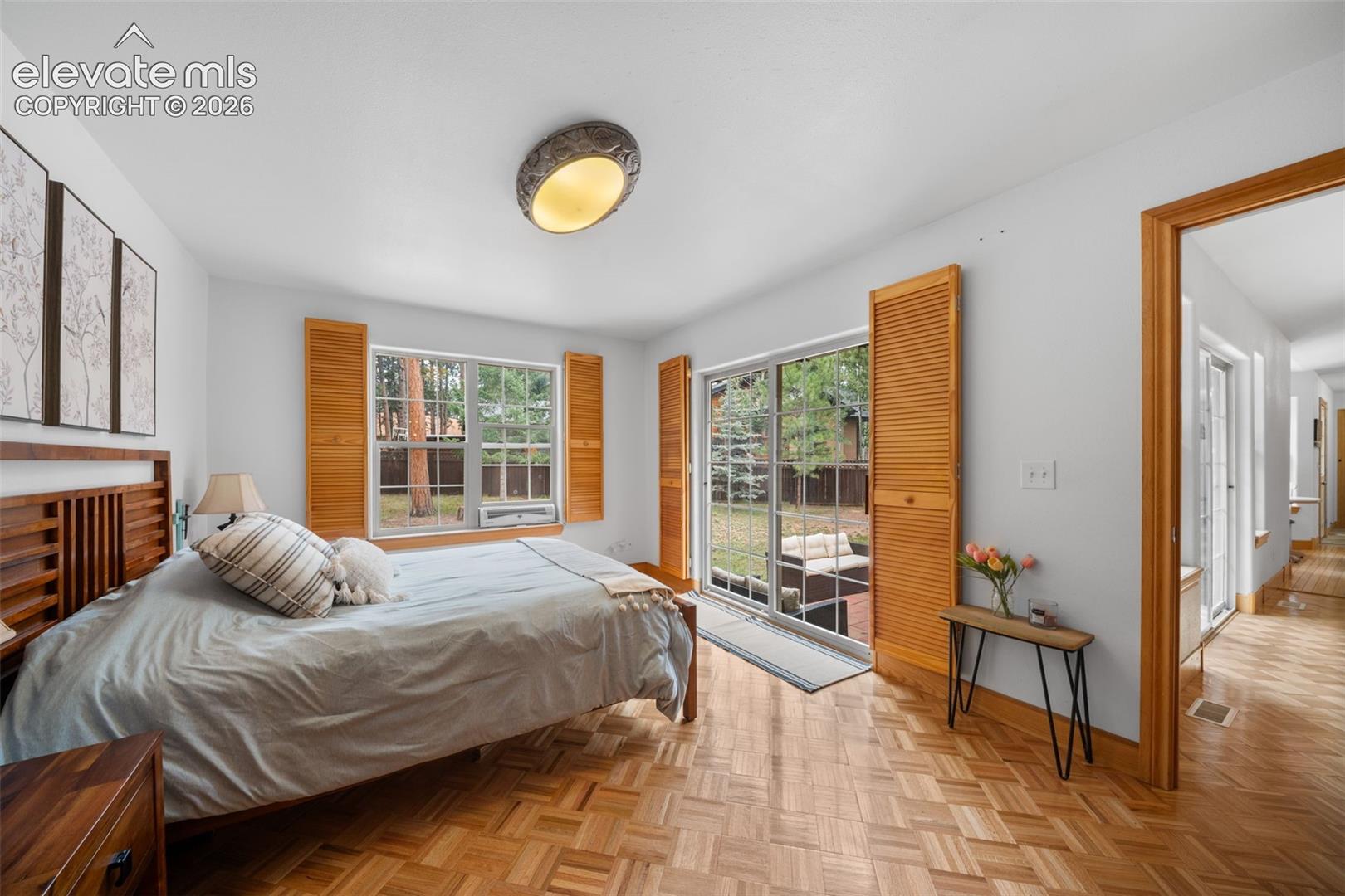 Main level bedroom with private access to the backyard patio