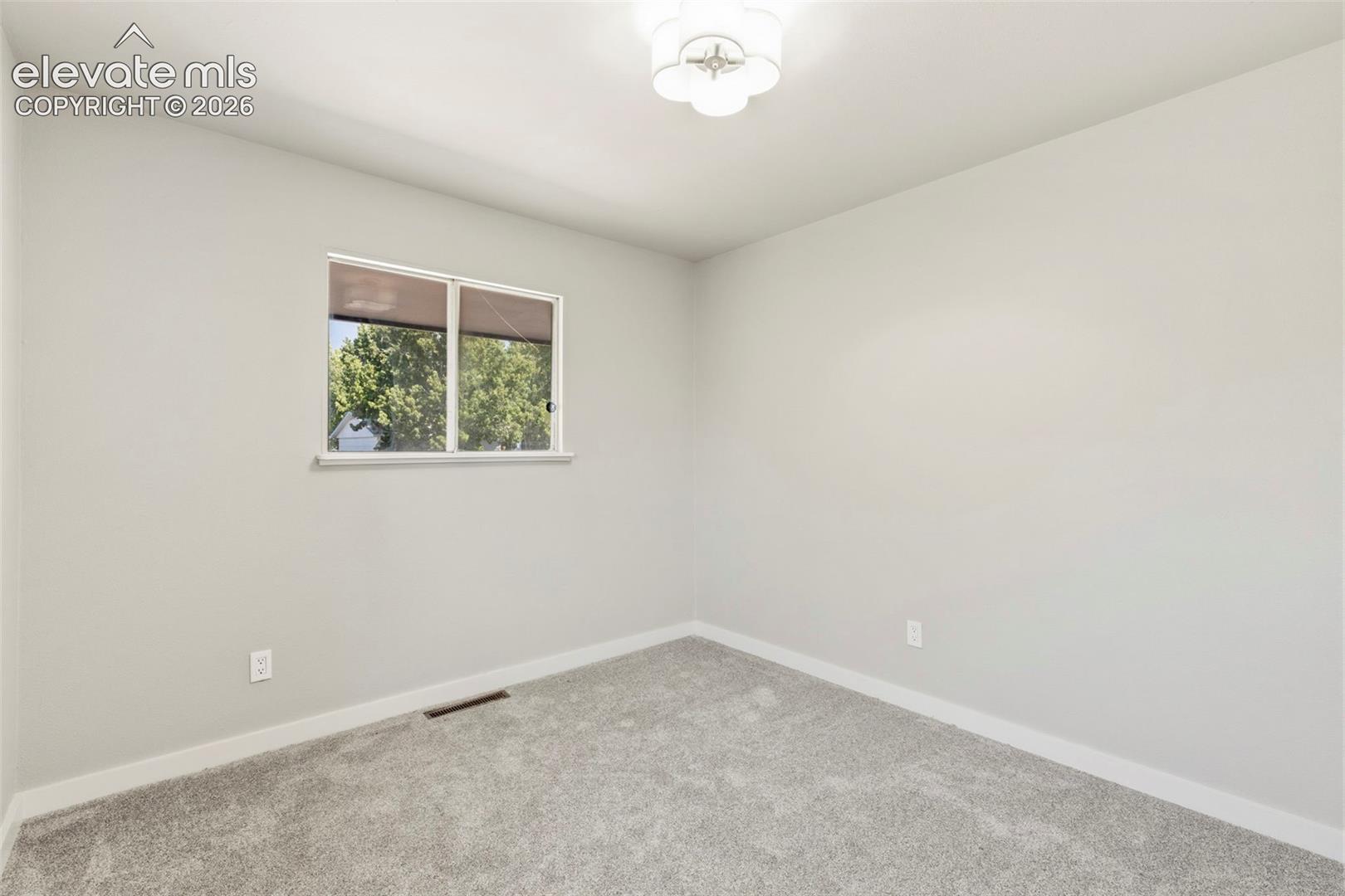 Light taupe carpeting and painted walls