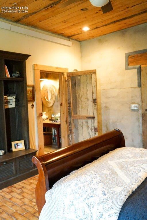Distressed wood ceiling featuring recessed lighting
