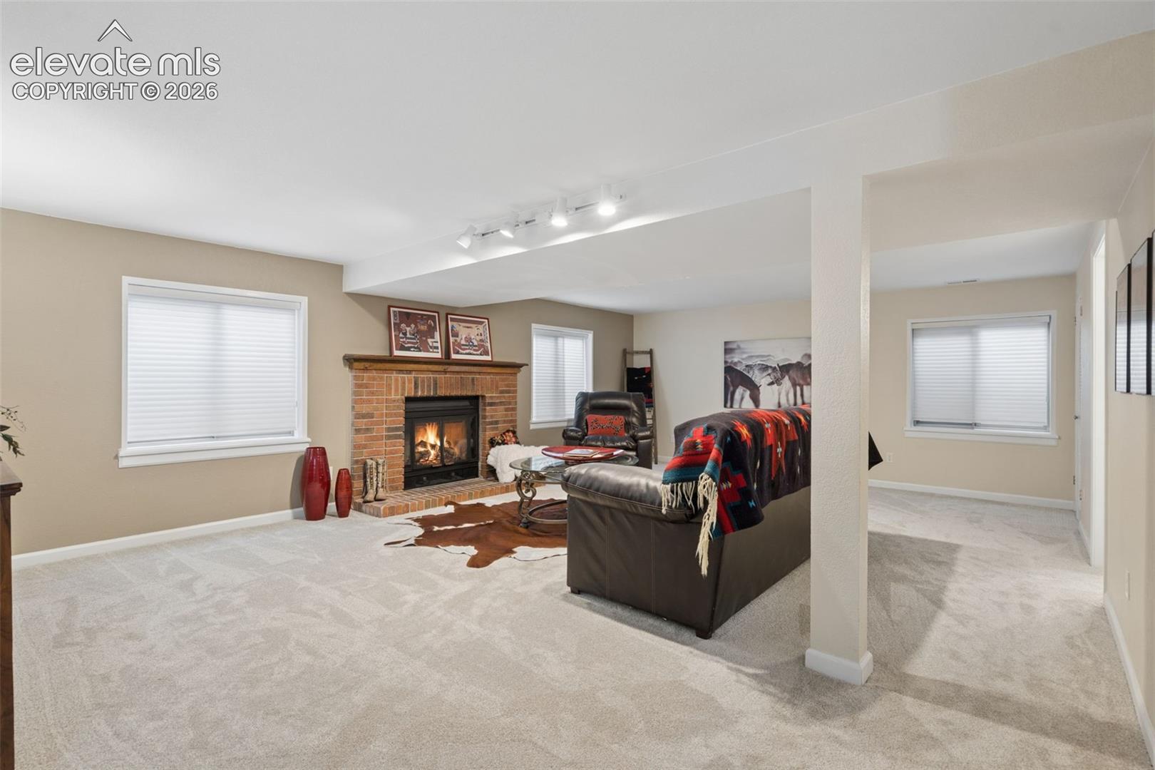 All new carpet throughout makes this a warm space.  Upgraded blinds on the windows.  