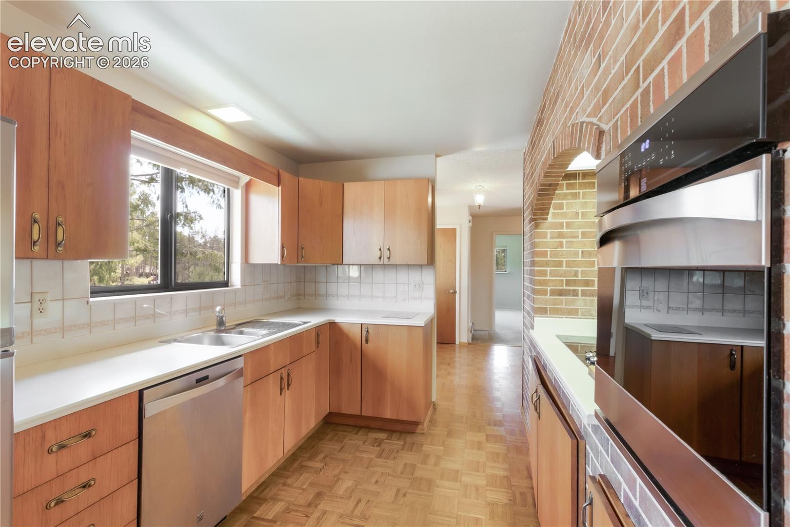 Kitchen, looking toward the entryway 