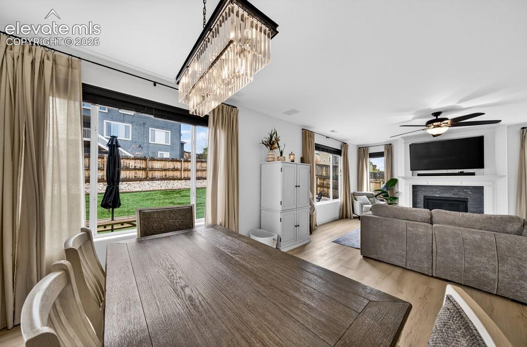 Walk out to backyard, luxury vinyl, chandelier, large windows
