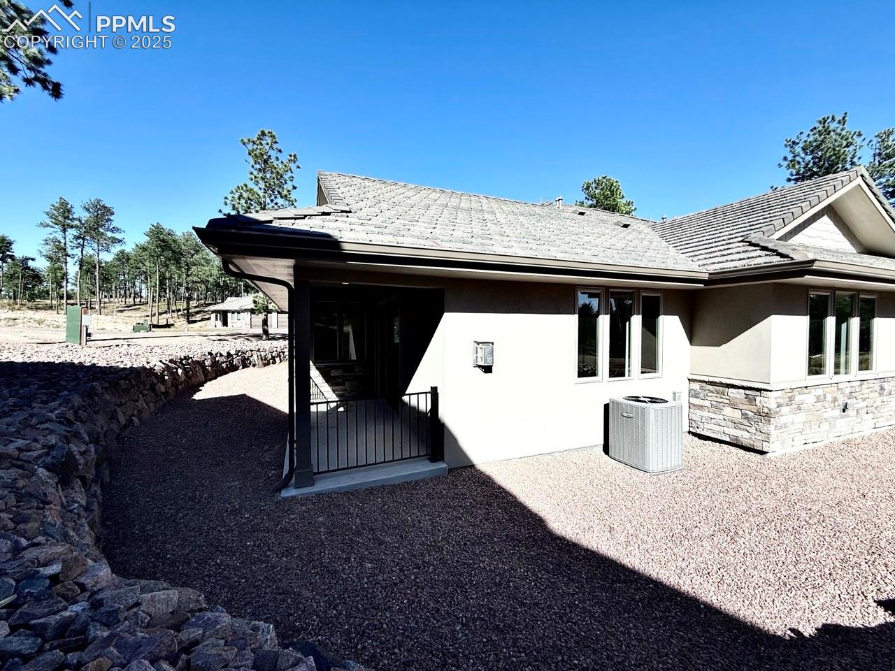 Stone and Stucco exterior with tiled roof make this low-maintenance.