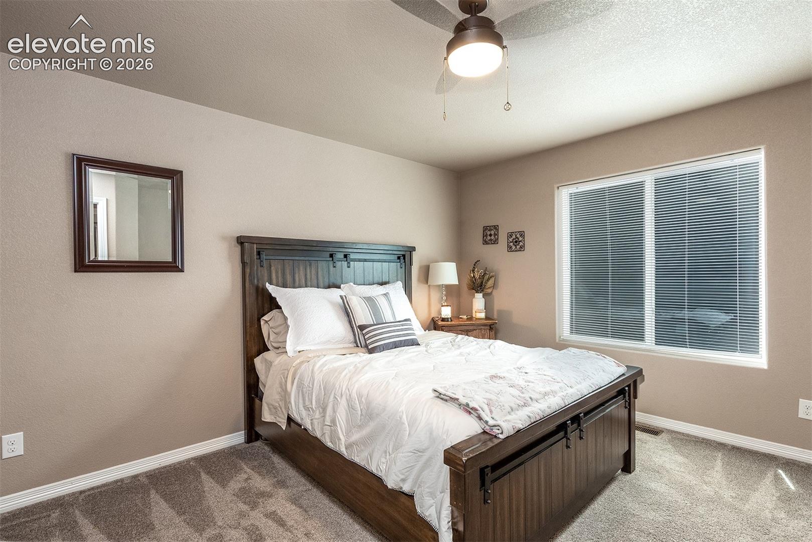 Third bedroom featuring a walk-in closet