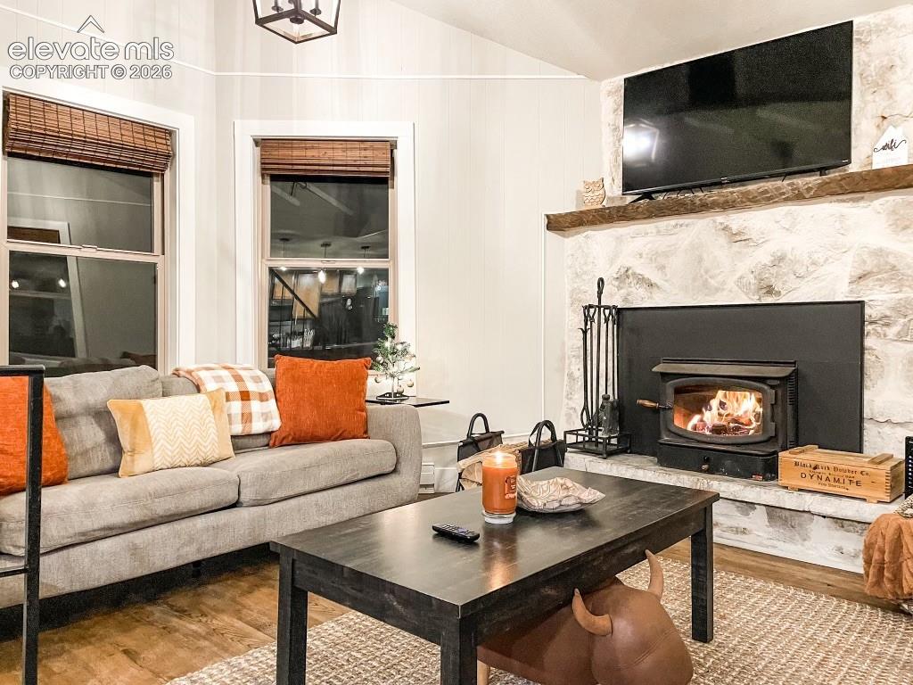 Stone-faced fireplace with wood-burning stove insert