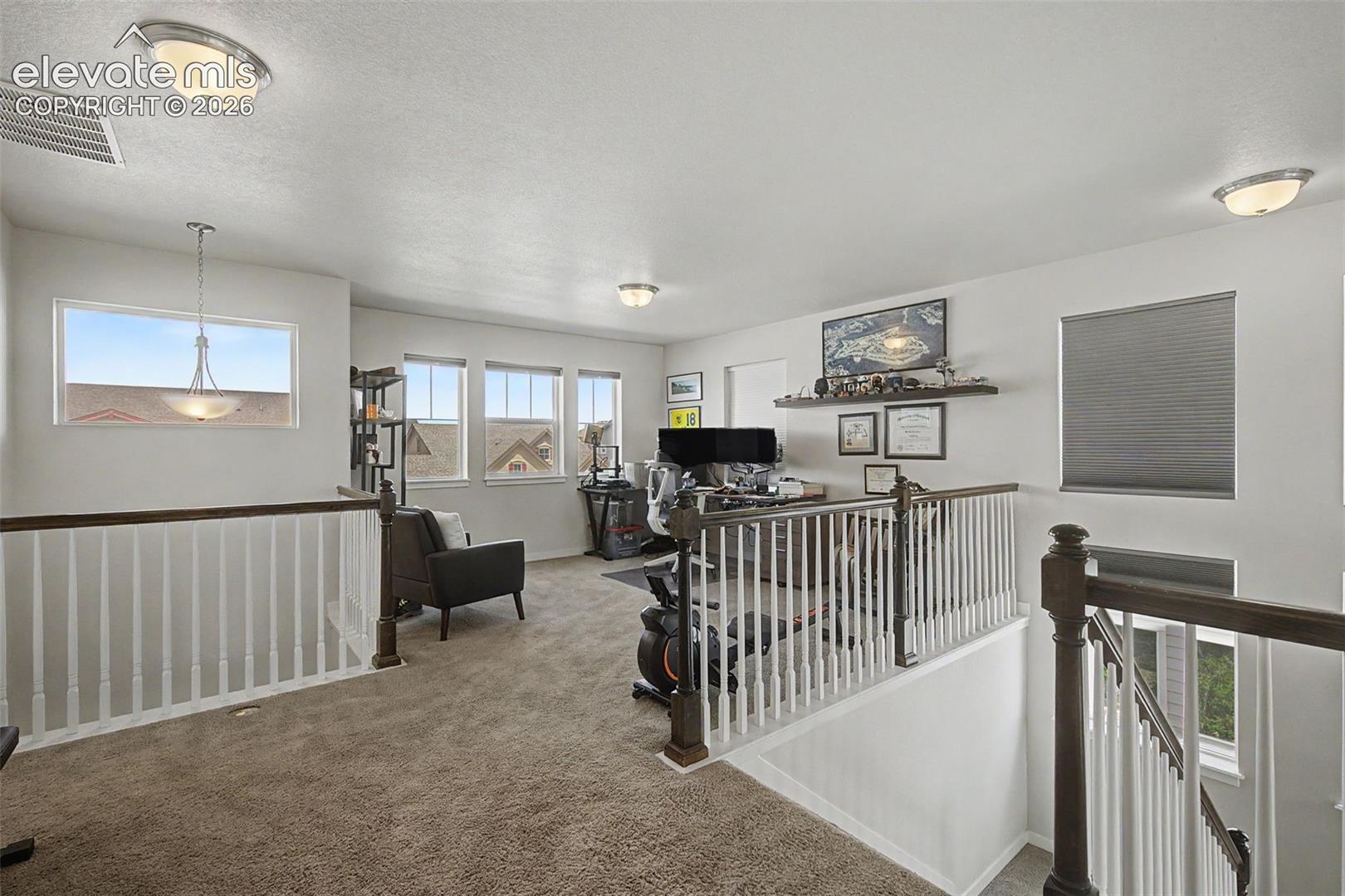 The versatile loft may be used in any way you need... exercise room, playroom, office or 2nd family room.