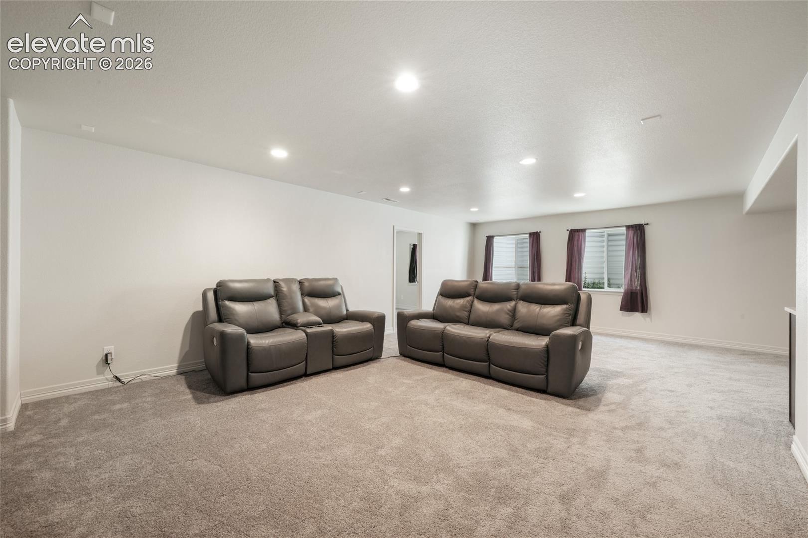 Basement family room with mini wet bar, new carpet