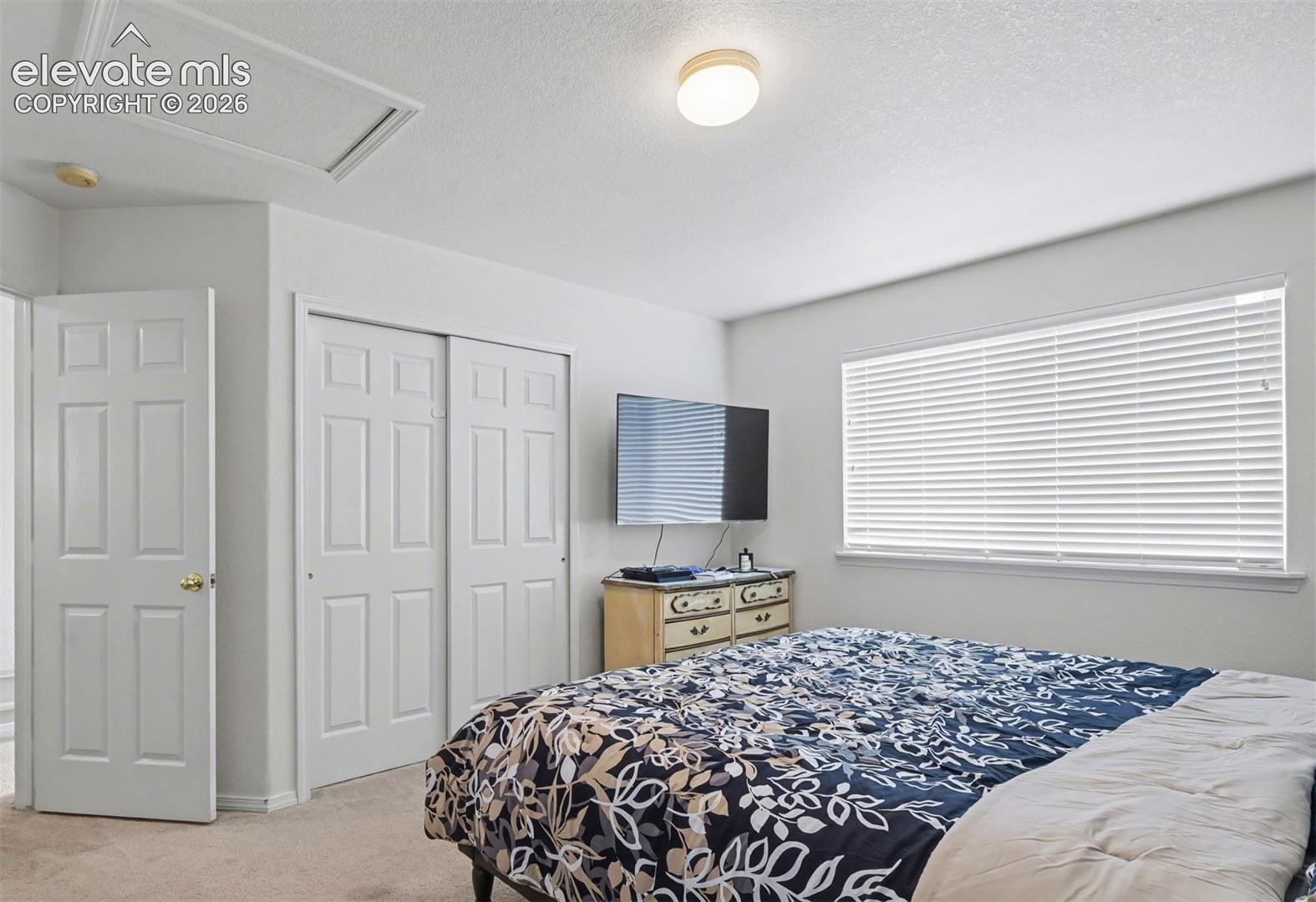 Upper level secondary bedroom adjoins the jack-n-jill full bath