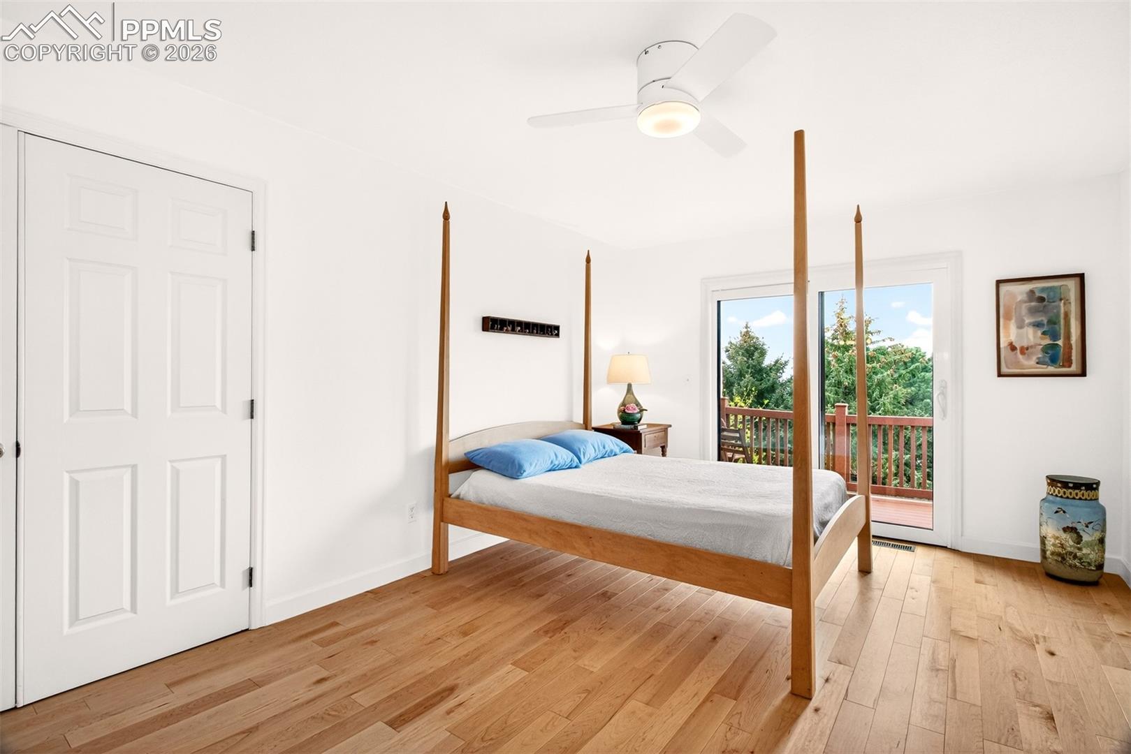 Enter the primary bedroom through french doors featuring those beautiful maple hardwood floors.  Relax and enjoy the scenic views from the walkout deck.