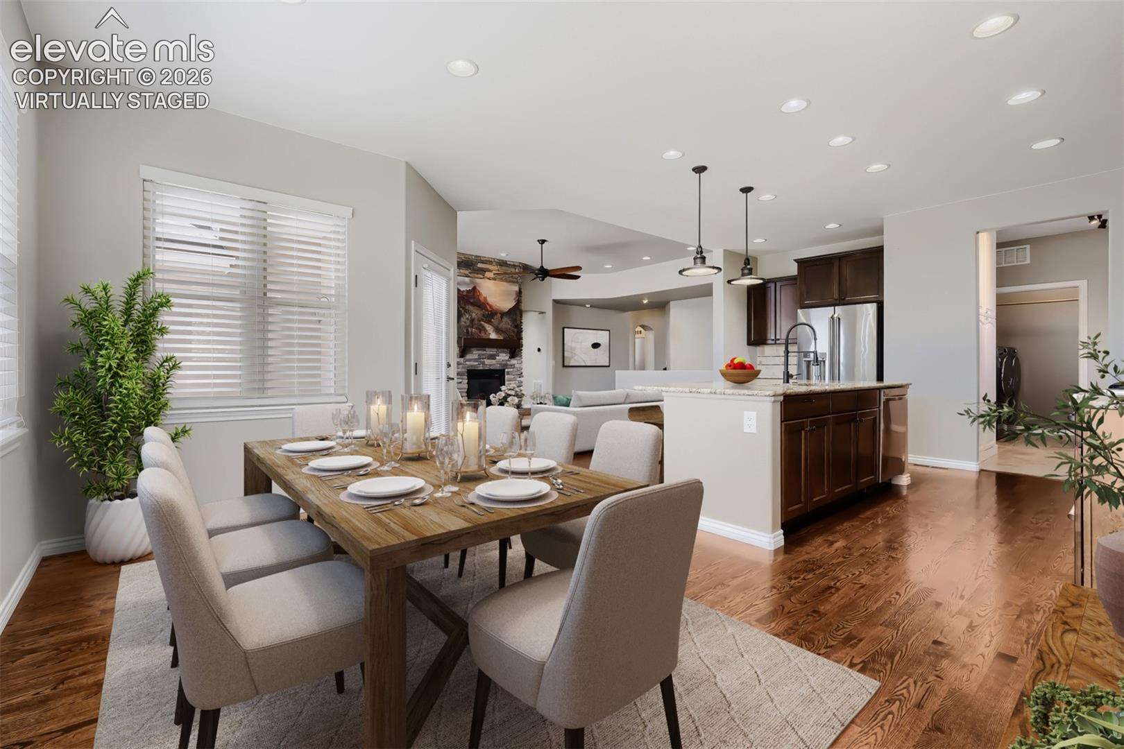 Virtually staged, beautiful dining room with spacious design, open concept floor plan, all out to deck and gorgeous wood floors.
