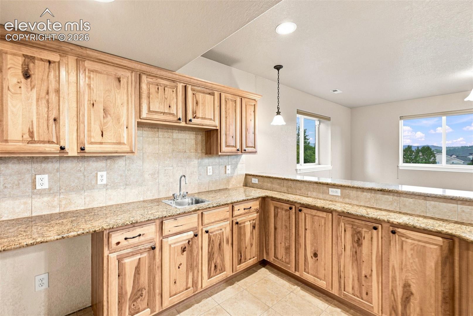 Large Wet bar with granite and space for entertainment!