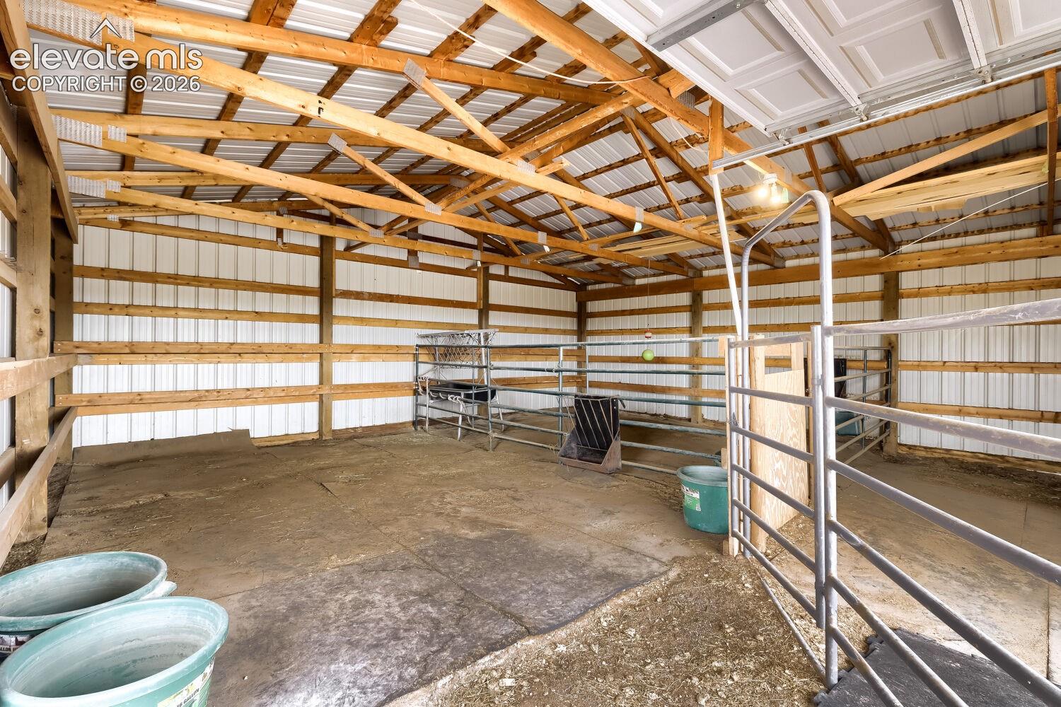 First stall equipped with heated watering device, hay feeder and 4H hoof padding.