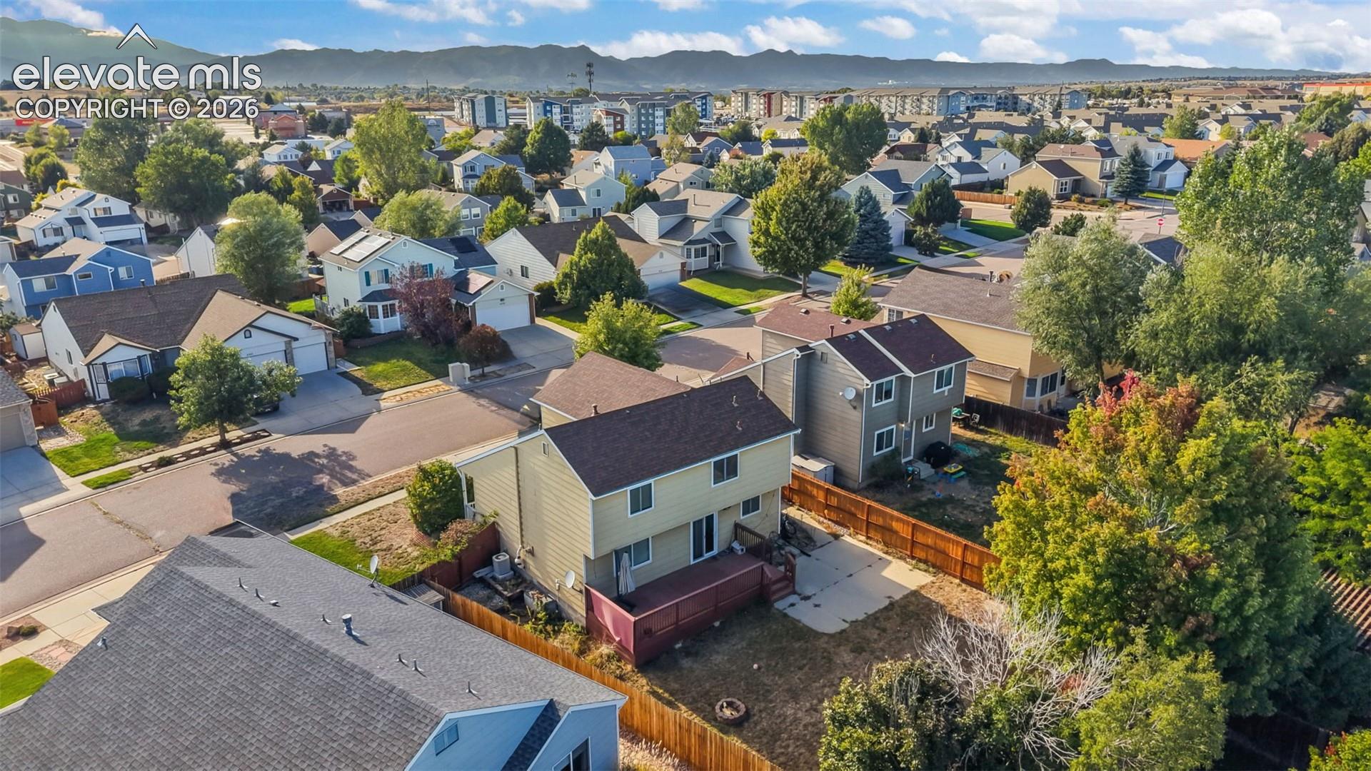 Residential neighborhood with varied architectural styles and mature trees