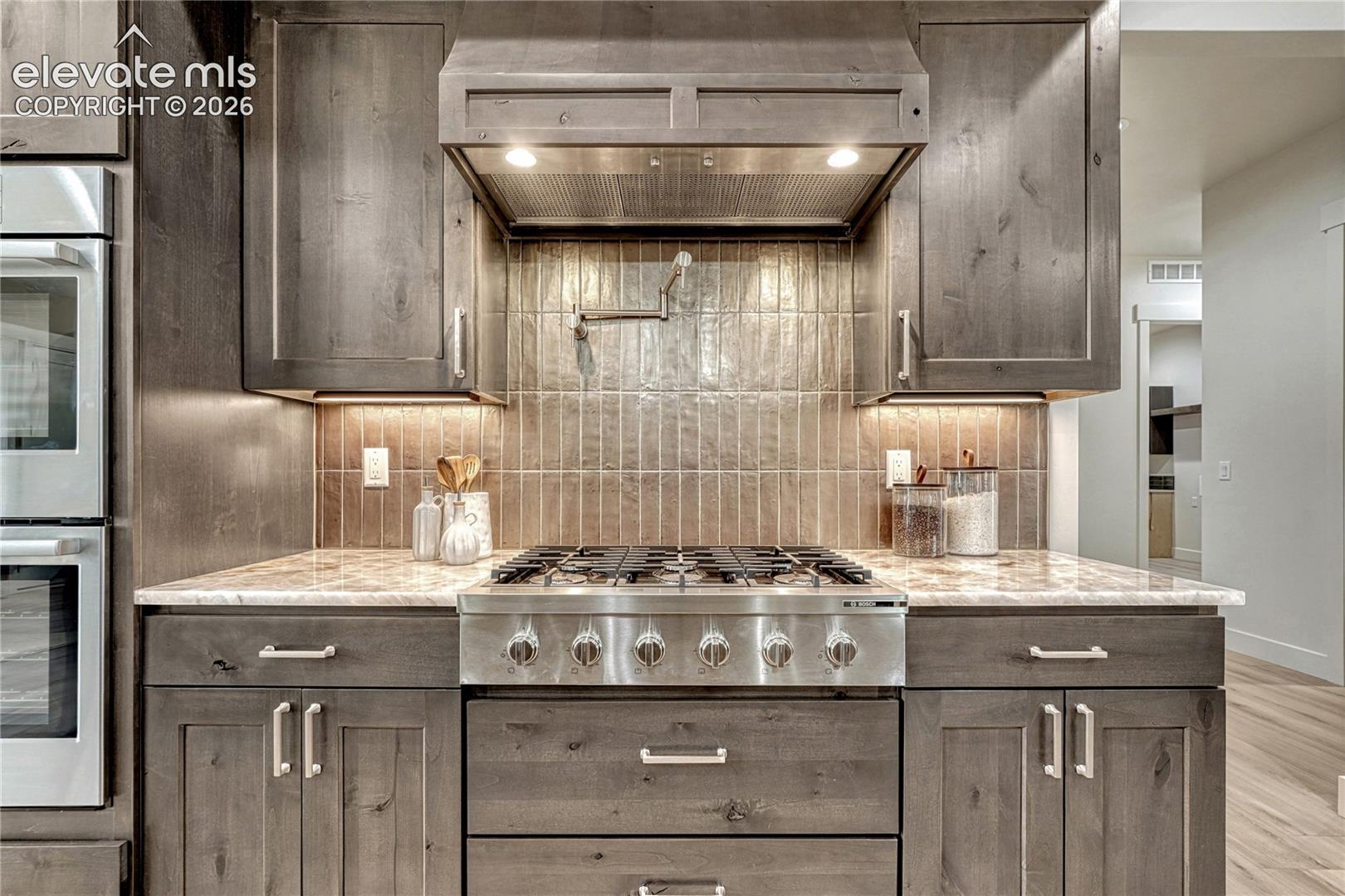 ...pot filler, gas cooktop, double oven...