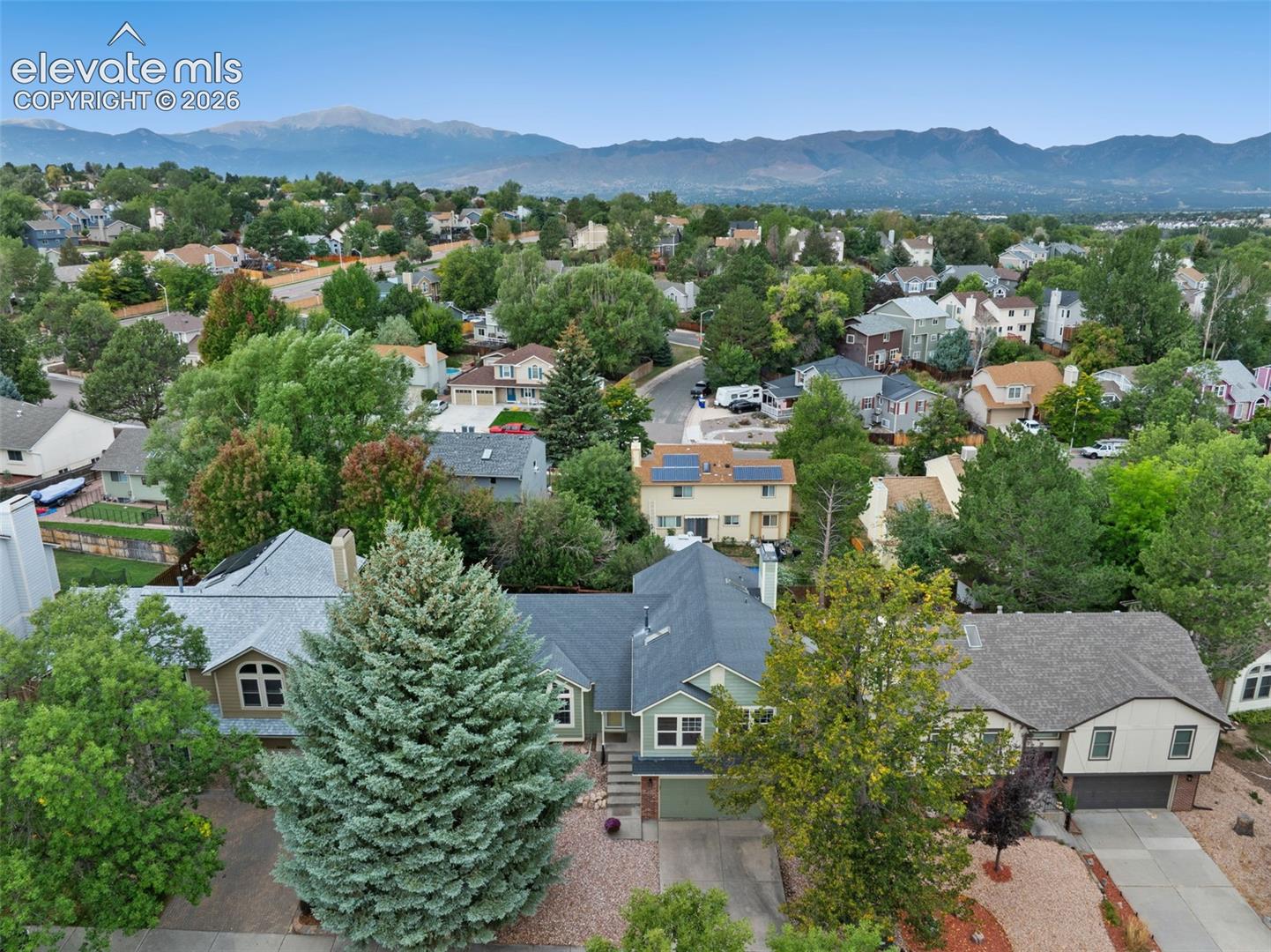 Mountain backdrop with established residential landscaping