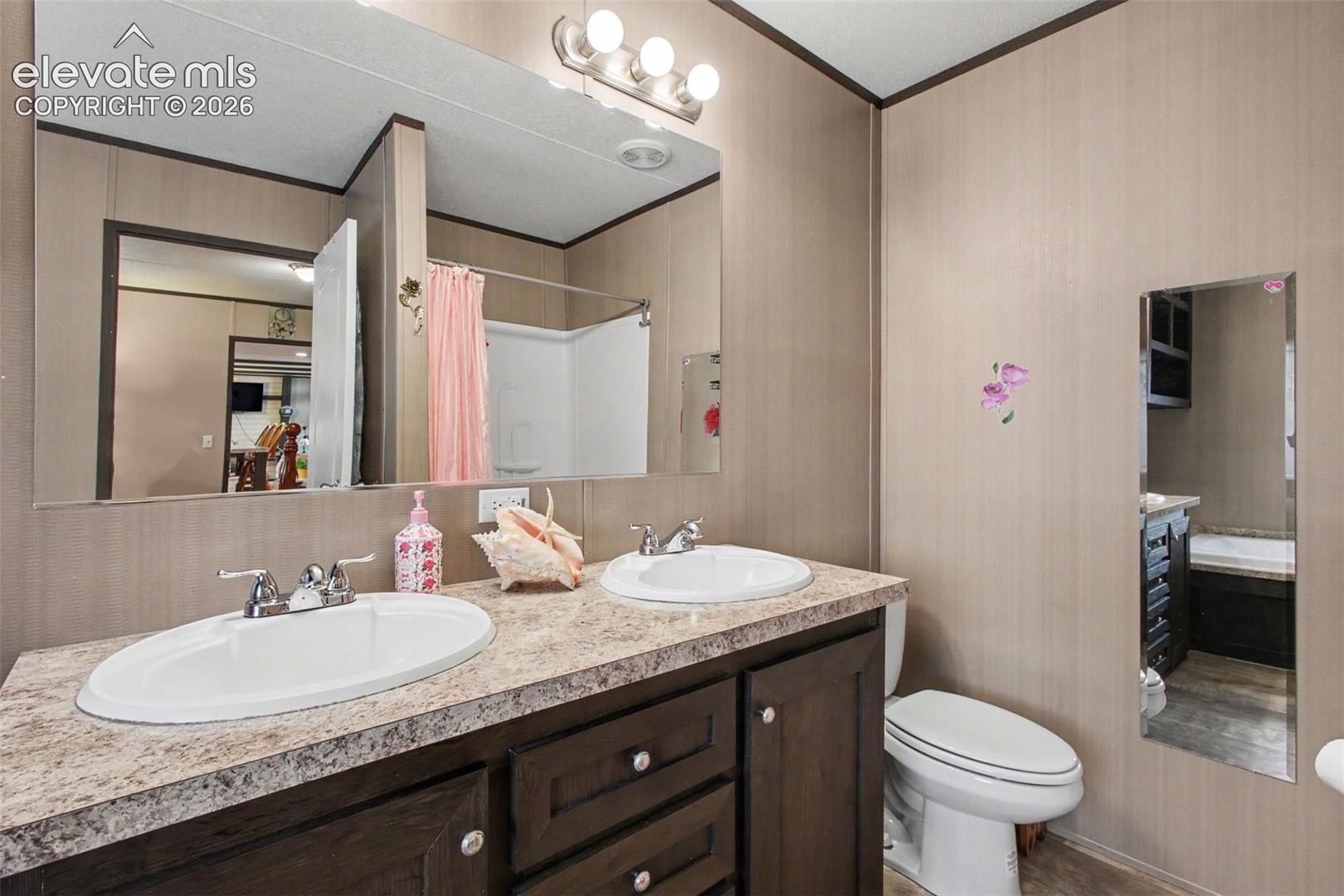2nd Home: Beautifully designed 5-piece bathroom featuring dual sinks and a separate shower for a comfortable, spa-like experience.