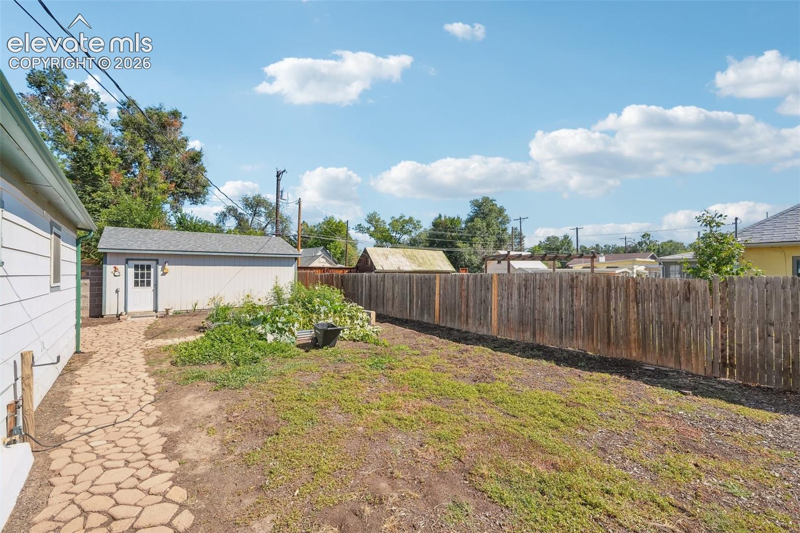 Spacious backyard looking at detached garage