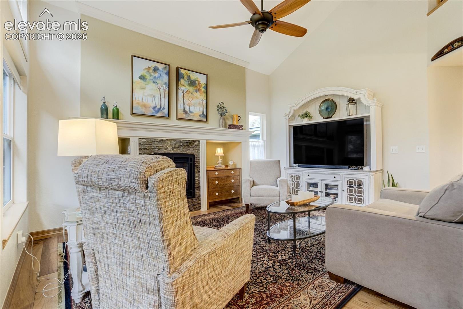 Family room features vaulted ceilings and a gas fireplace.
