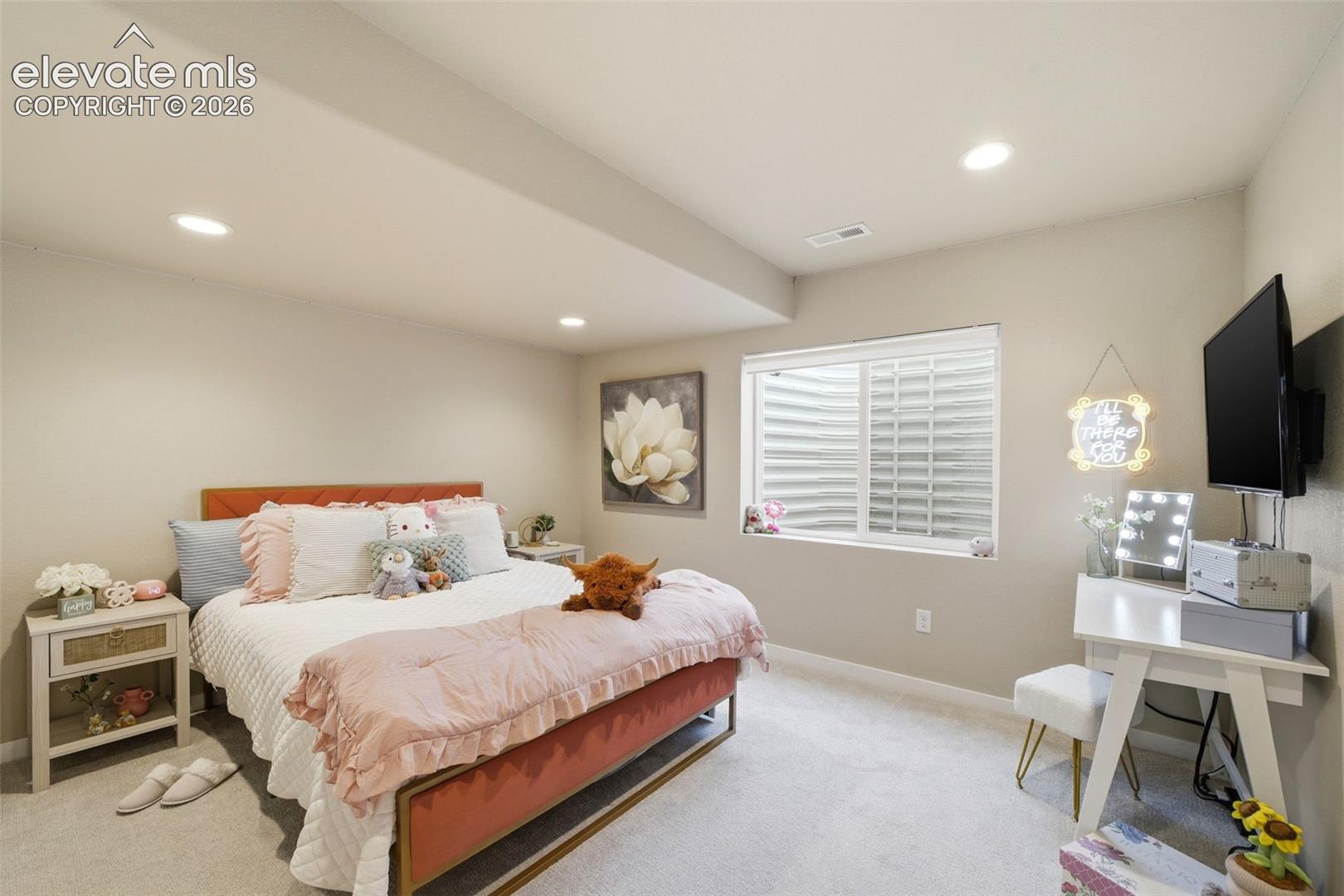 Fifth bedroom in the basement is sizable and ready for your Pinterest ideas. 
