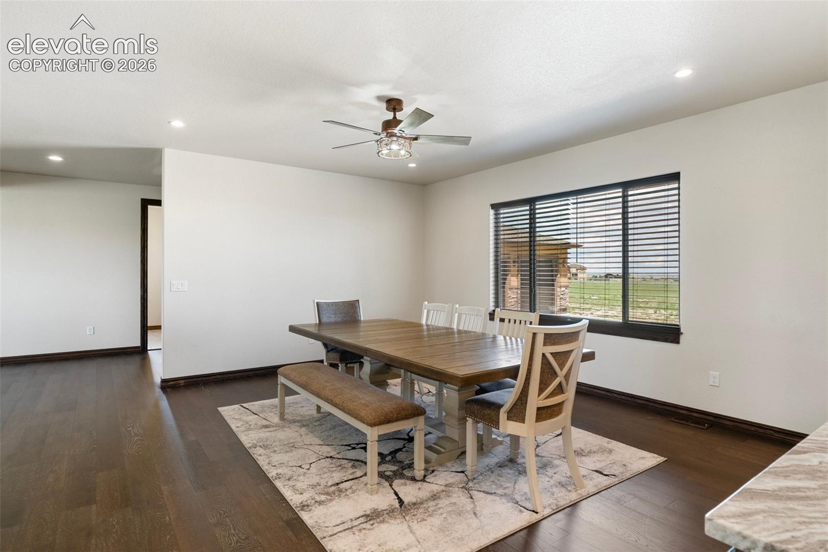 Formal Dining area featuring dark wood-finish flooring, recessed lighting, and a contemporary ceiling fan
