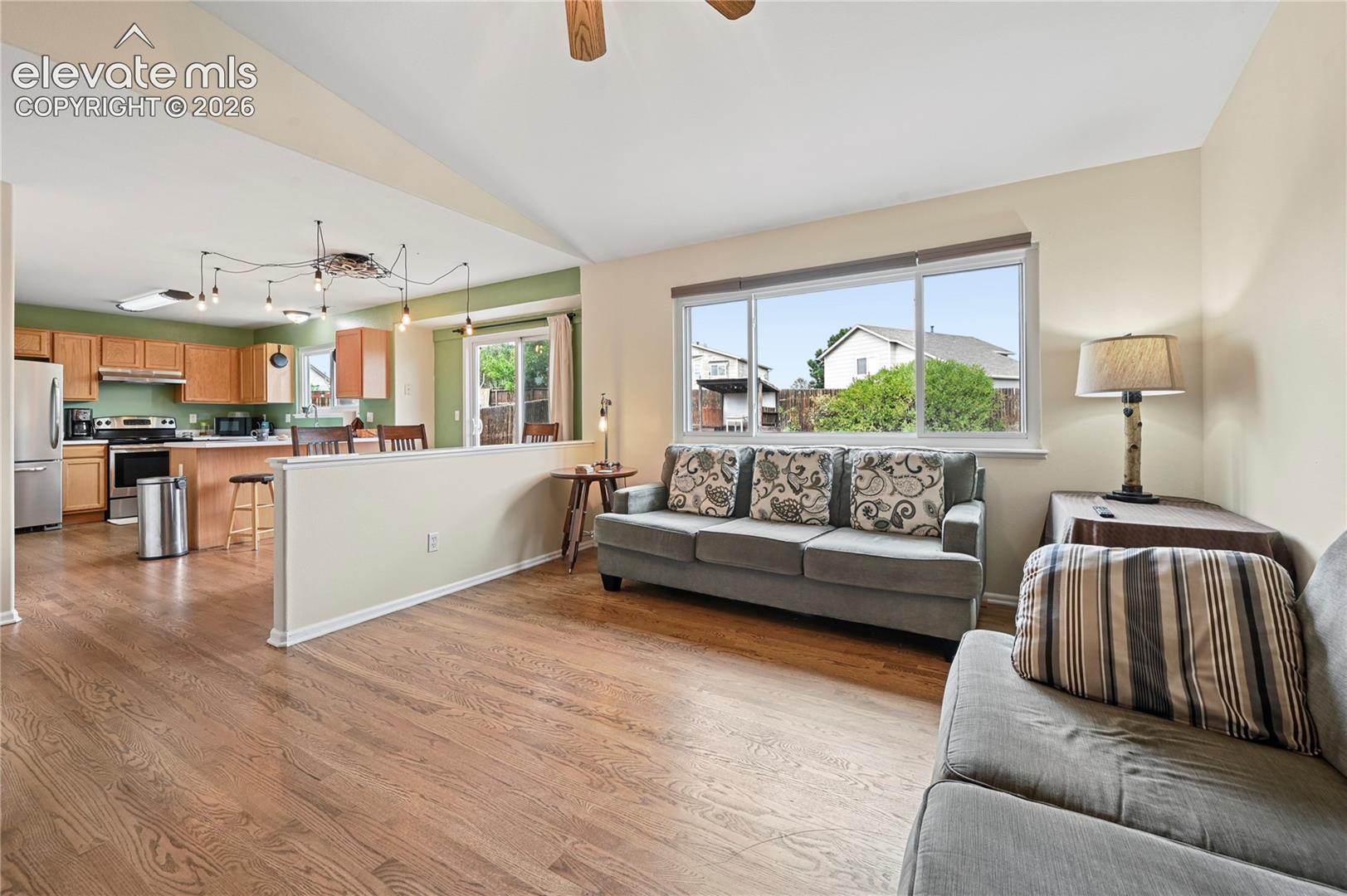 Living room is part of the joined spaces in the heart of the home