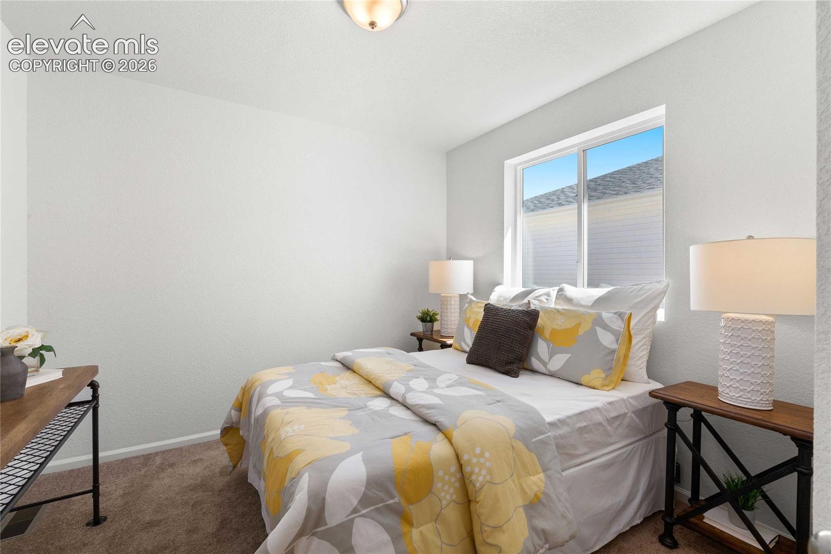 Recessed ceiling light fixture, white painted walls, single window, and neutral tone carpet flooring
*photos  of a model home*