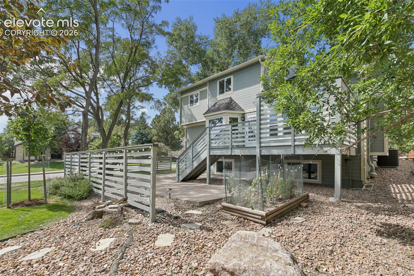 Enjoy the best of both worlds: a secluded patio behind privacy fencing, plus generous yard space beyond for games and activities.