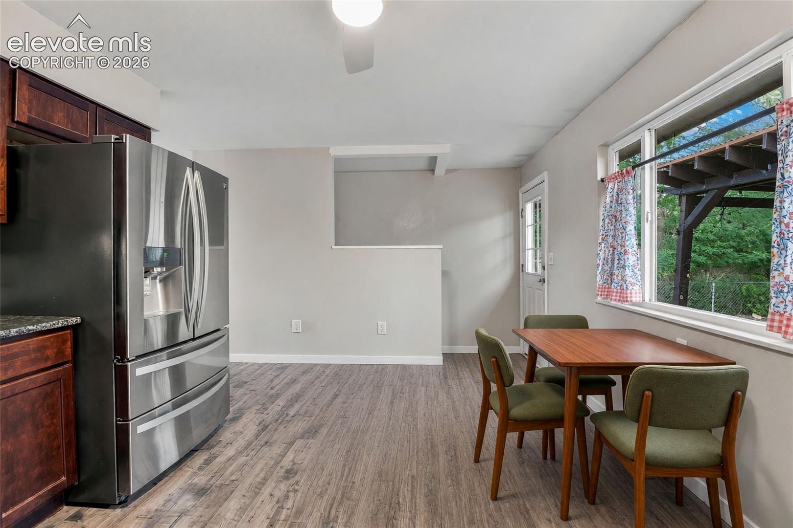 Kitchen with space for dining and walk-out to backyard