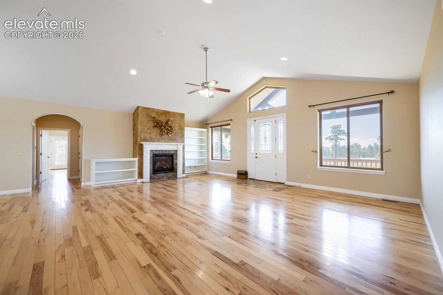 Observe the arch leading you into the Owners suite, an office and the basement stairway.