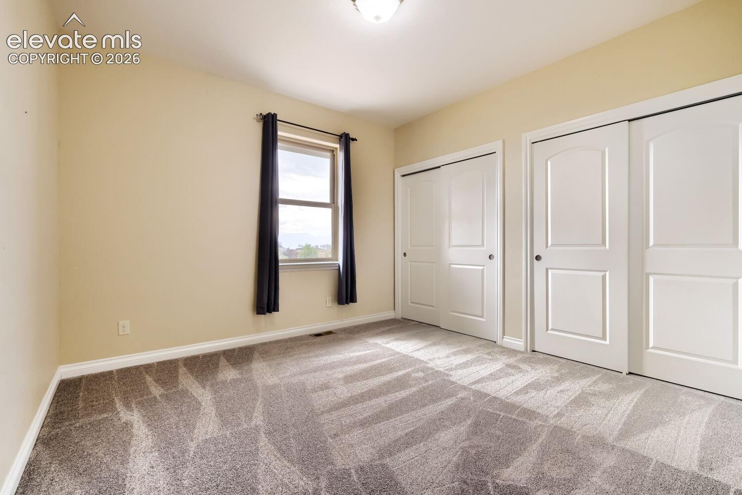 One of three main floor bedrooms in addition to the main floor office. The carpet is brand new! 