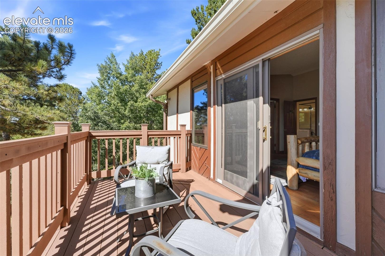 Expansive outdoor deck with wood-finish railing and decking