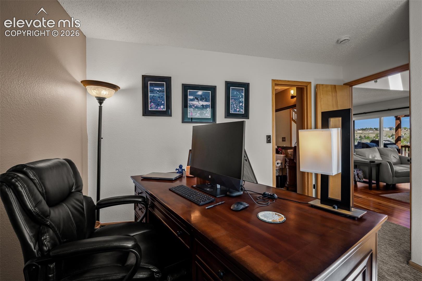 Main floor office or bedroom opening to family room and 3/4 bathroom.