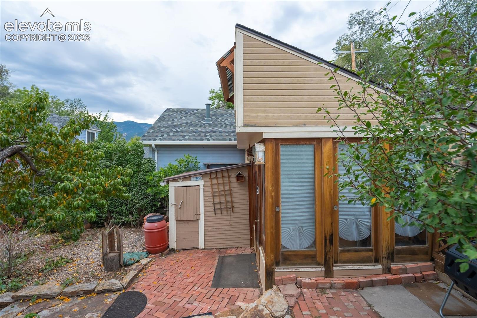 The small shed is attached to the workshop/storage space.