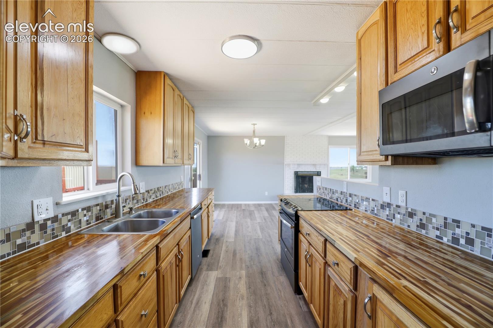Butcher Block, Open Concept, Vinyl Plank, Mud Space Through Kitchen, Dining Room Sliding Door Off Kitchen