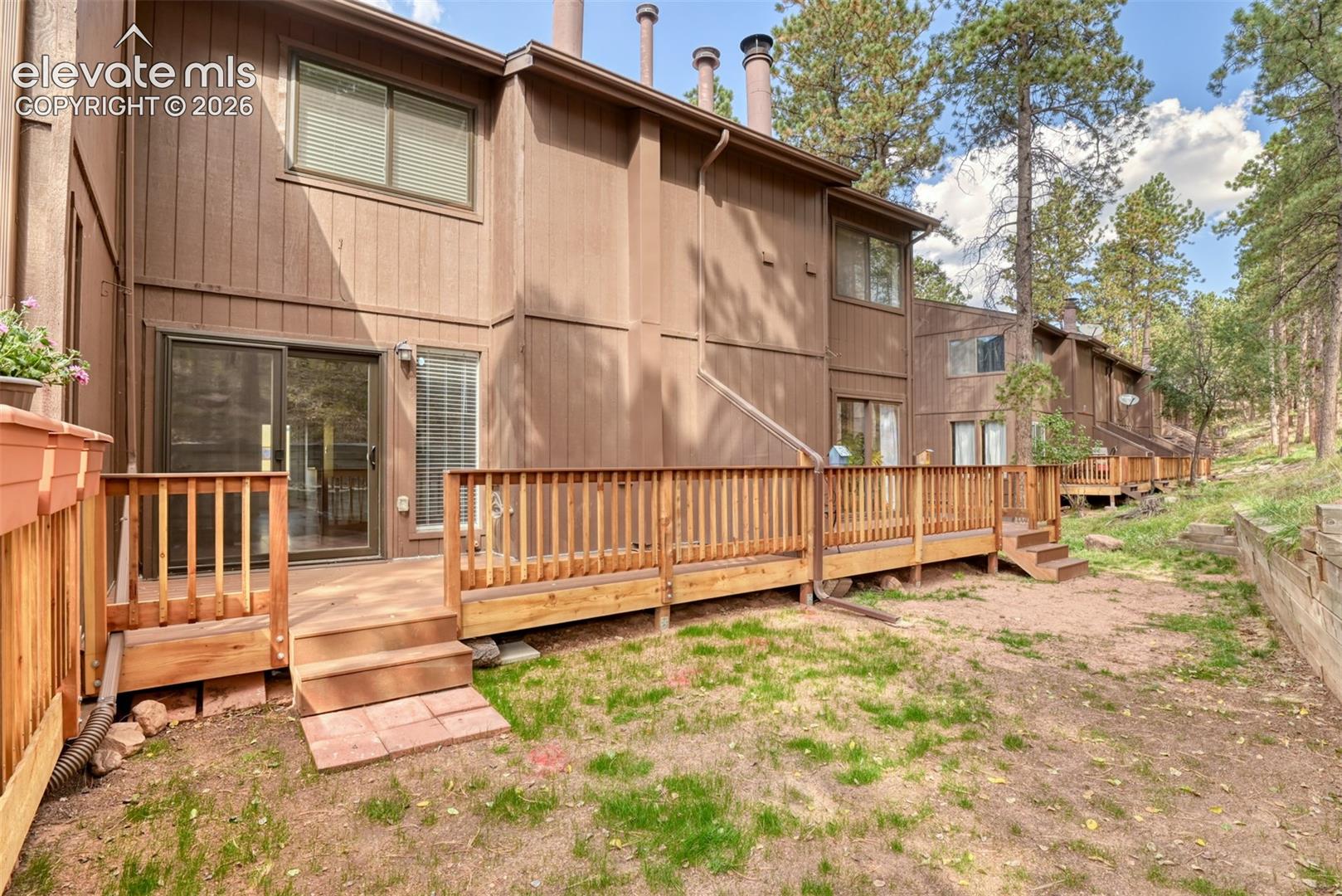 Private wood deck with wood railings