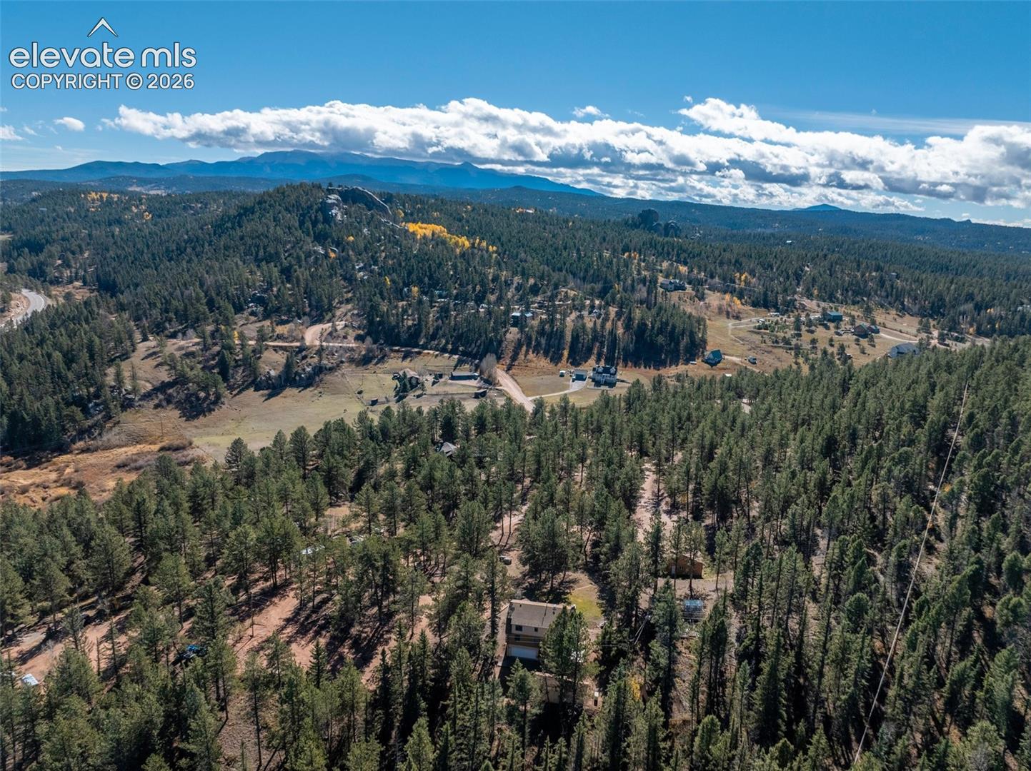 Aerial view house which sits on included Lot 106 with 2432 sq. ft. house on 3.24 acres.