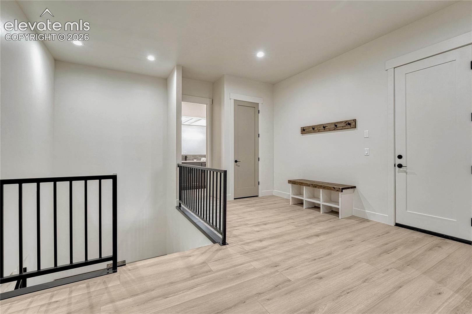 A spacious mud room area accesses the main level, the lower level and the garage...