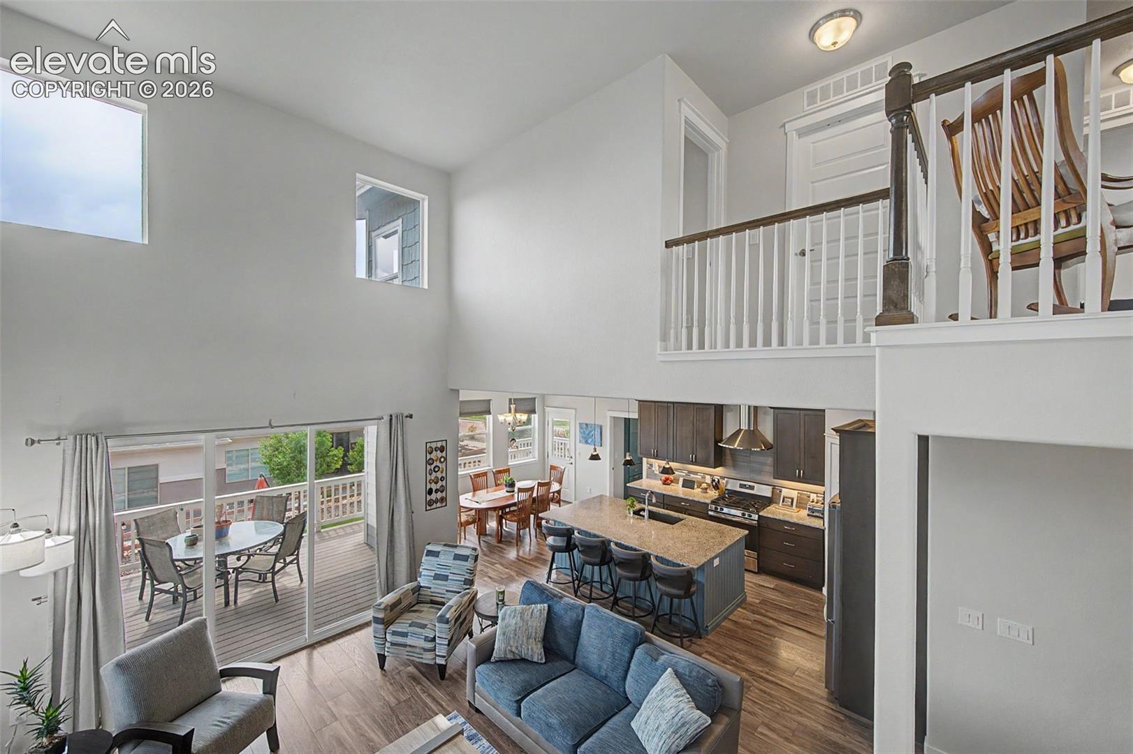 View of the open living area from the stairs to the upper level.