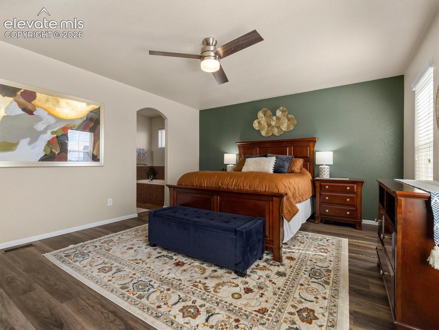 LVP flooring with a neutral wall color and an accent wall