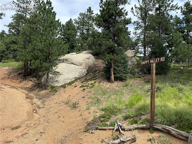 The entrance to happy valley road with rock outcroppings
