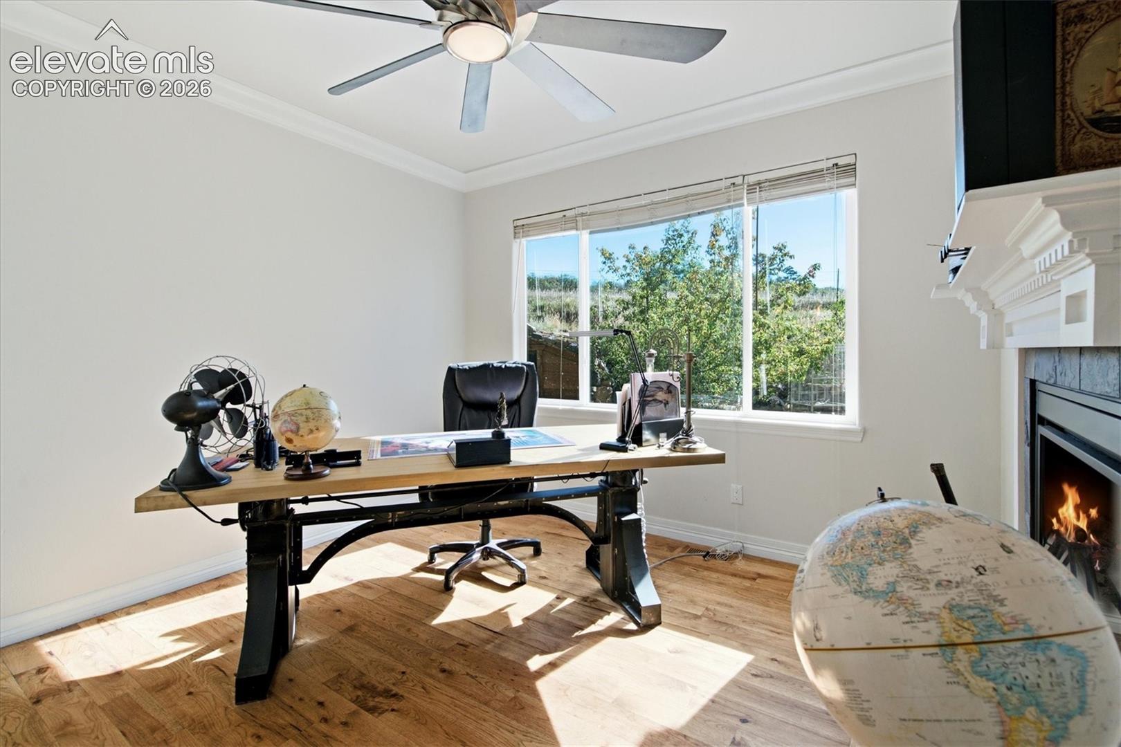 Main floor office or family room w see through fireplace