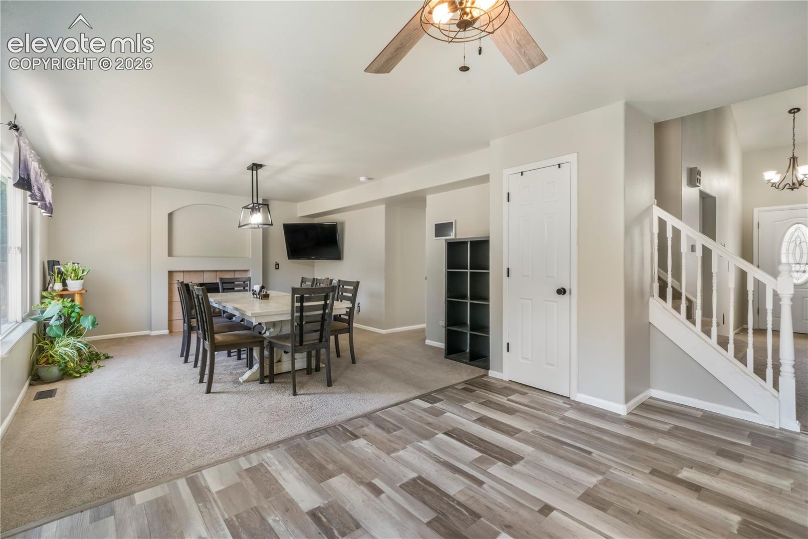 Kitchen with new LVP floors looking into dining room/family room with access out to patio